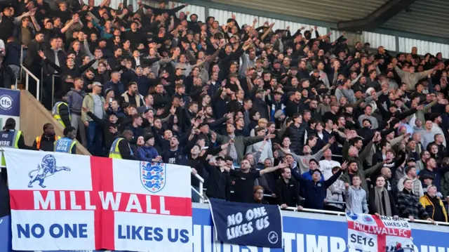 Millwall fans sing in unison at The Den