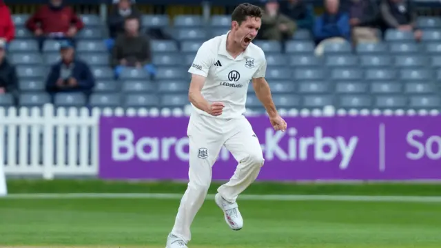 Will Williams celebrates the wicket of Zak Crawley