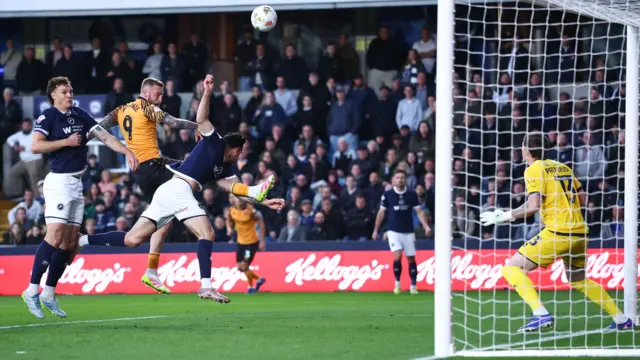 Oli McBurnie sends a header goalwards