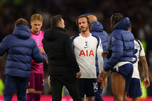 Tottenham players and De Zerbi chat on the pitch at full time