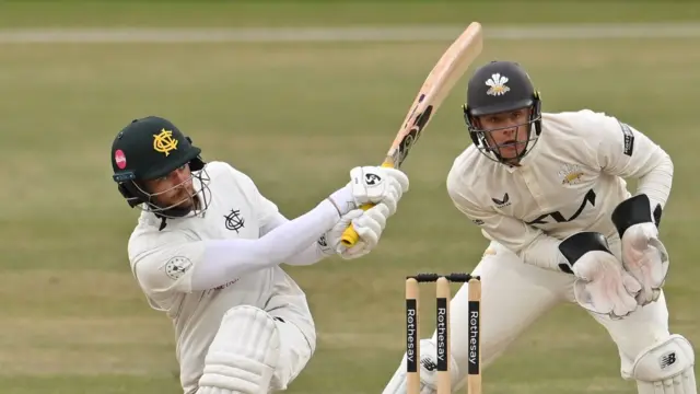 Nottinghamshire batter Joe Clarke sweeps against Surrey