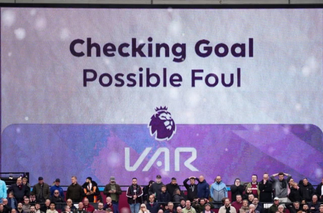 The big screen showing a VAR check for a foul on Arsenal goalkeeper David Raya