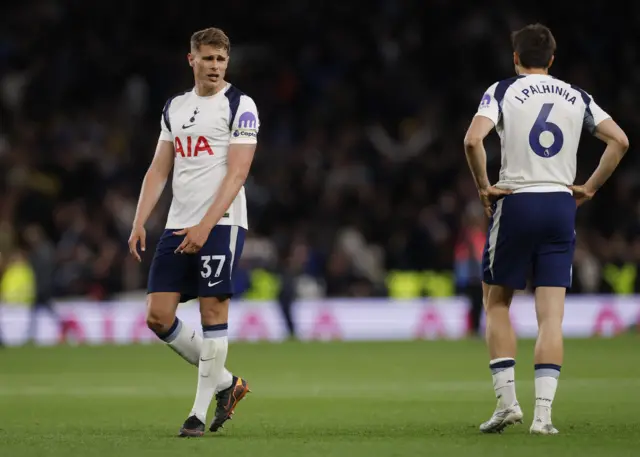 Tottenham players react to the full time whistle