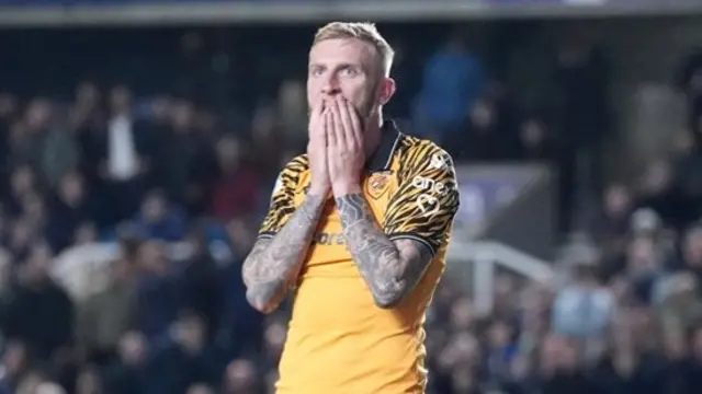 Hull striker Oli McBurnie has his hands over his mouth