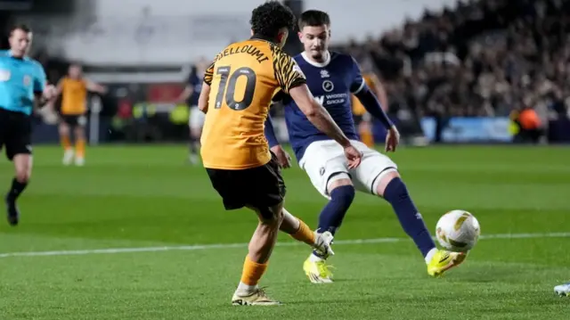 Hull's Mo Belloumi curls the opening goal of the game