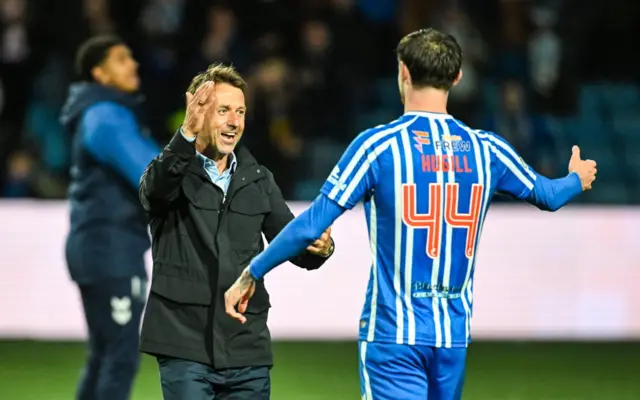Neil McCann celebrates with Joe Hugill
