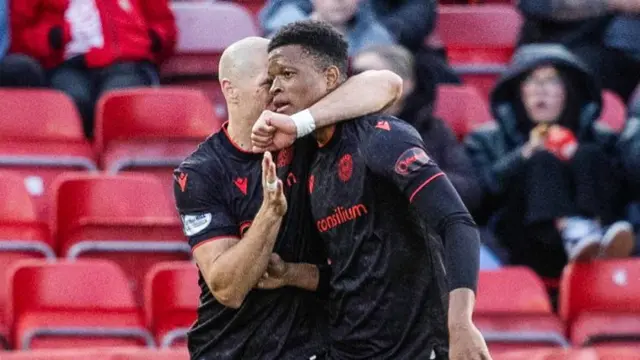 Alex Gogic celebrates with Richard King