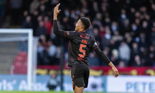 Richard King celebrates his goal