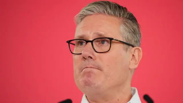 Starmer, with a red background