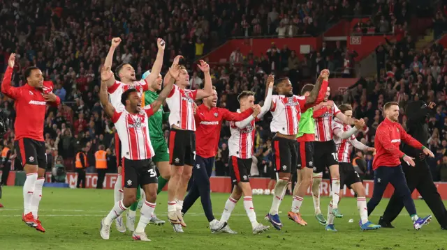 Southampton players celebrate at full-time in front of their fans