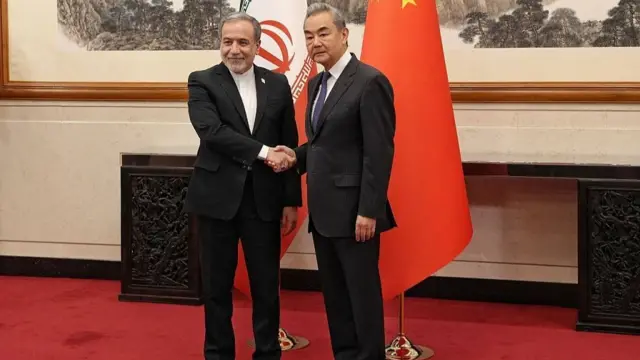 Iran's foreign minister Abbas Araghchi (left) met with Wang Yi last week