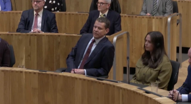 Rhun ap Iorwerth sitting in the Senedd