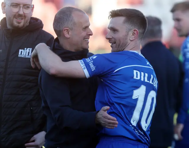 Dungannon’s Kealan Dillon celebrates winning with manager Rodney McAree