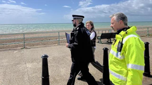 Ch Supt Hays (left) and Graham Easton, area commander for HM Coastguard (right), leave the media briefing