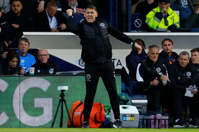 Dave Challinor giving instructions on the sidelines.