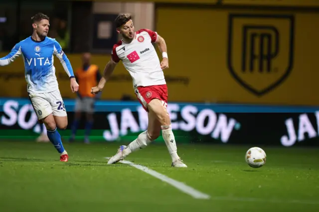 Charlie Goode of Stevenage shoots at goal.
