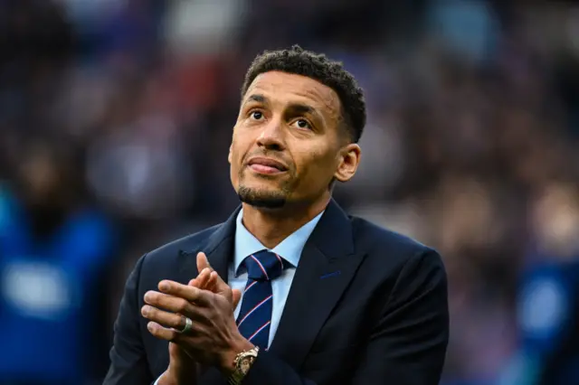 James Tavernier applauds the crowd at Ibrox