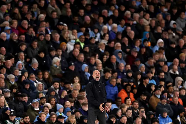 Pep Guardiola, Manager of Manchester City, reacts