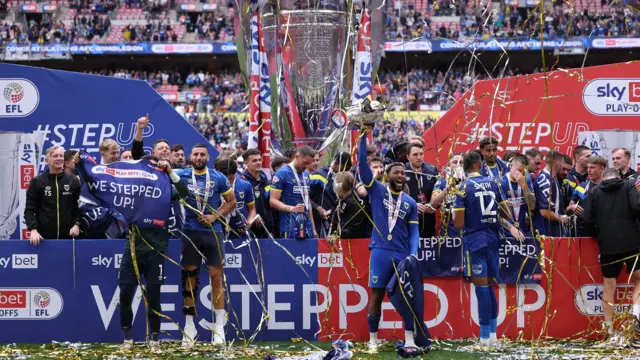 AFC Wimbledon celebrate winning the EFL League Two play-off final last seaason