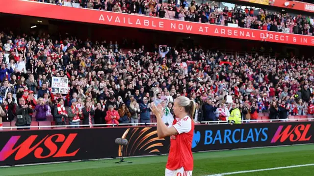 Mead is applauded as she does a lap in front of the fans at the Emirates