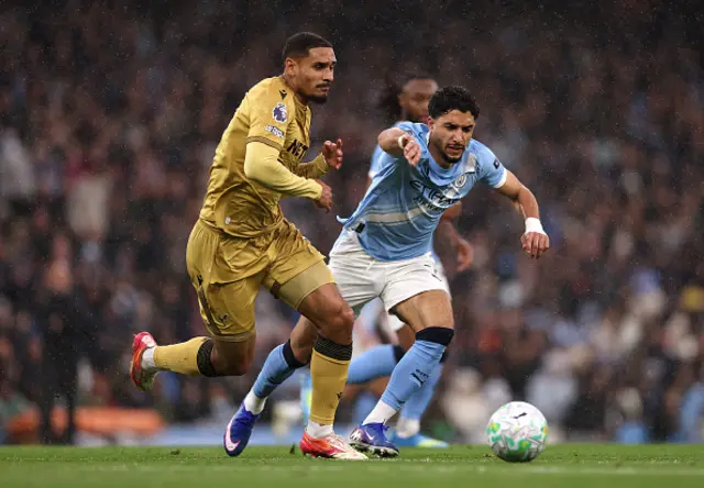 Maxence Lacroix of Crystal Palace on the ball while under pressure from Omar Marmoush