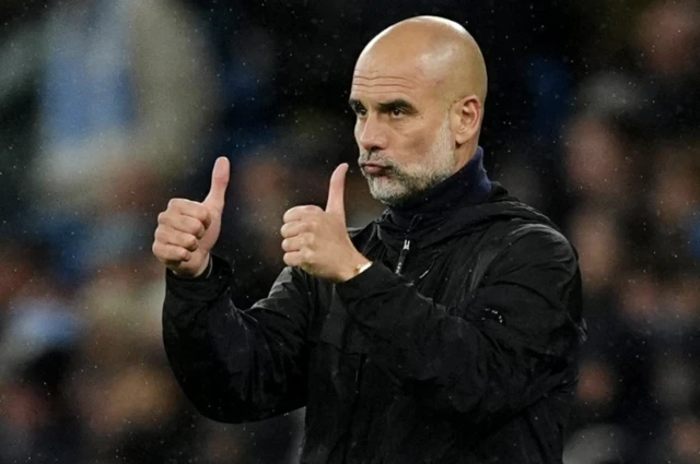 Manchester City manager Pep Guardiola gives a thumbs up