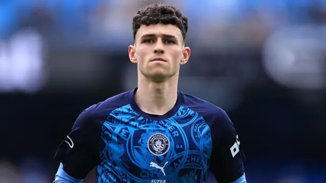 Phil Foden of Manchester City looks on
