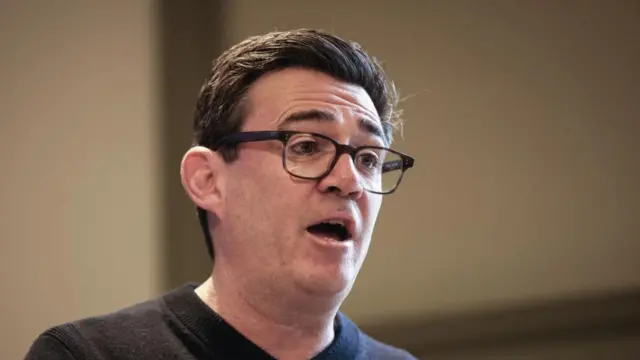 A file photo of Andy Burnham speaking at a podium