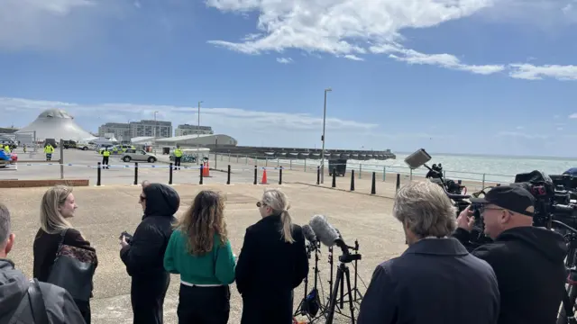 Press gathered on Brighton seafront ahead of a police conference held by Sussex Police