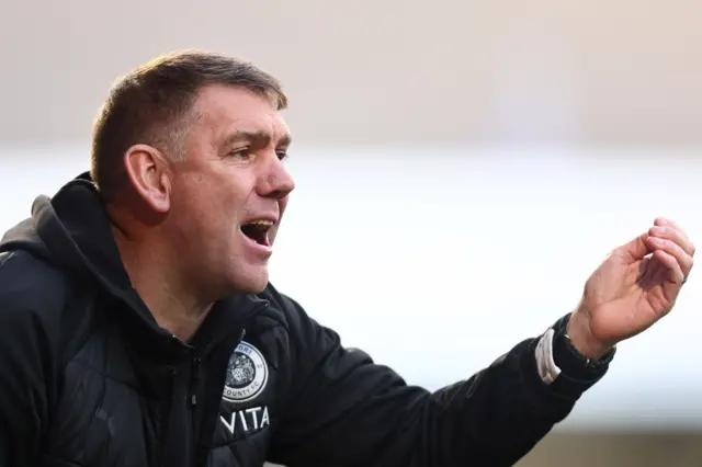 Dave Challinor giving instructions on the sideline.