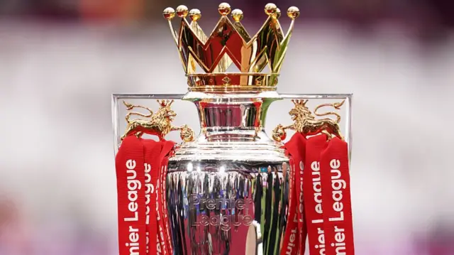 The Premier League trophy is on display ahead of kickoff during the Premier League match between West Ham United and Arsenal at London Stadium, London,