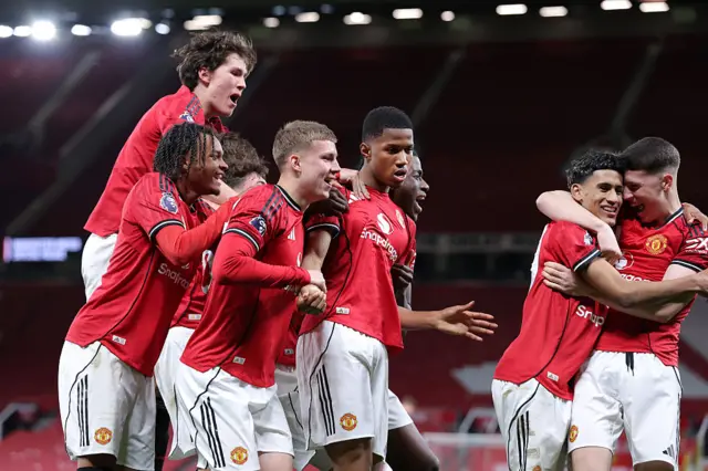 Chido Obi of Manchester United celebrates with team mates after scoring their second goal during the FA Youth Cup Semi Final match between Manchester United and Crystal Palace at Old Trafford