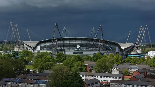 Rain clouds hover over The Etihad Stadium during the Premier League match between Manchester City and Crystal Palace