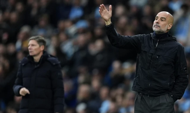 Manchester City manager Pep Guardiola (right) and Crystal Palace manager Oliver Glasner on the touchline