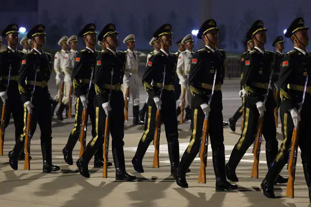 Members of a Military Honor Guard prepare for the arrival of U.S. President Donald Trump at Beijing Capital International Airport on May 13, 2026 in Beijing, China.