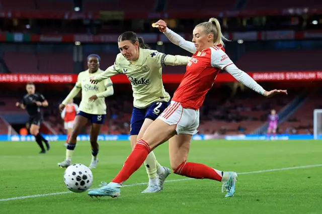Kelly tries to dribble past a defender