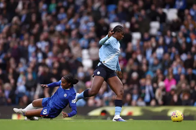 Shaw bowls past Girma on her way to scoring earlier this season