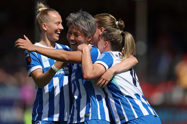 Seike is mobbed after scoring v Man City