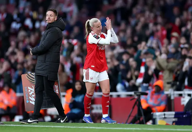 Mead claps the crowd as she leaes the pitch
