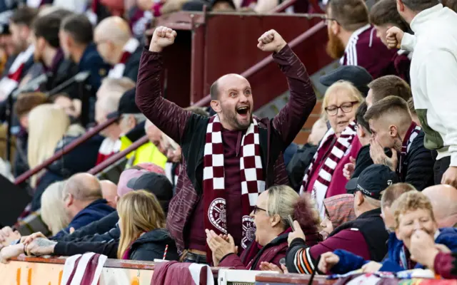 Hearts fan celebrates