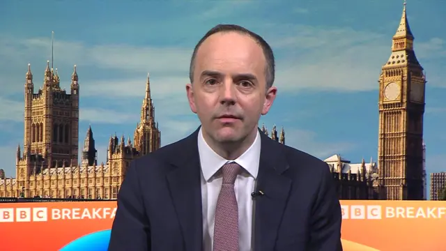 Murray speaks to BBC in front of a green screen showing parliament