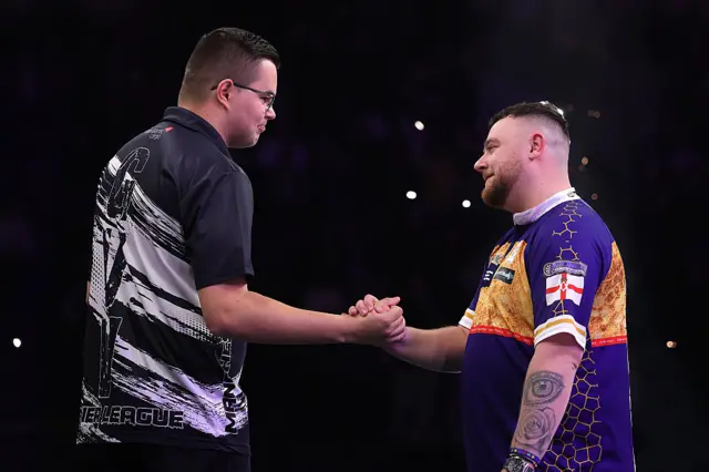 Gian van Veen and Josh Rock shaking hands