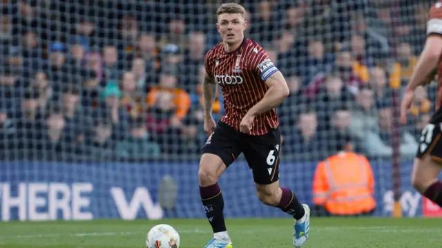 Bradford captain Max Power in action against Bolton