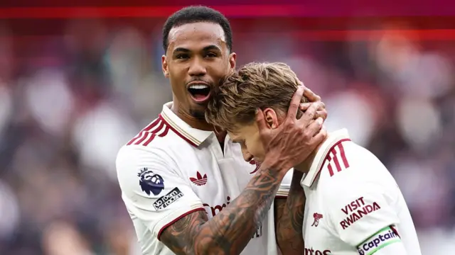 Gabriel of Arsenal celebrates victory with Martin Odegaard