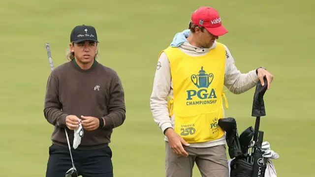 Garrick Higgo and his caddie