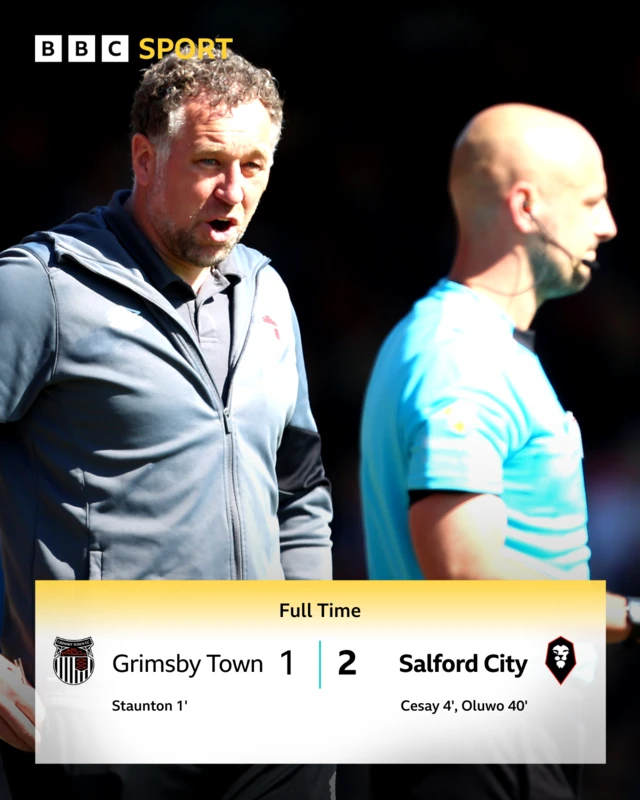 Grimsby Town manager David Artell has a word with the referee during their match against Salford City