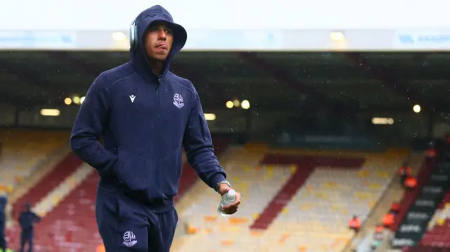 Bolton's Ethan Erhahon walks across the Valley Parade pitch