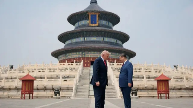 U.S. President Donald Trump and Chinese President Xi Jinping stand together as they tour the Temple of Heaven