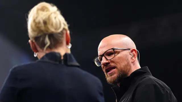 Sky Sports commentator and former darts player Mark Webster (right) during night fifteen of the 2026 BetMGM Premier League at the Utilita Arena, Birmingham