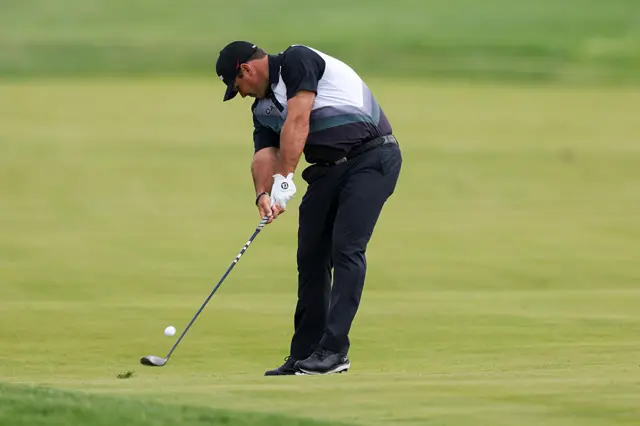 Patrick Reed hits a shot